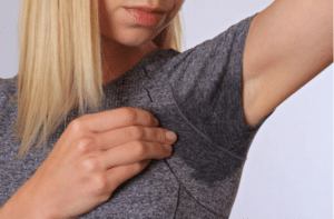 Sport woman armpit sweating.