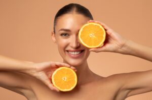 Natural,Vitamin,C,For,Skincare.,Happy,Woman,With,Organic,Slices