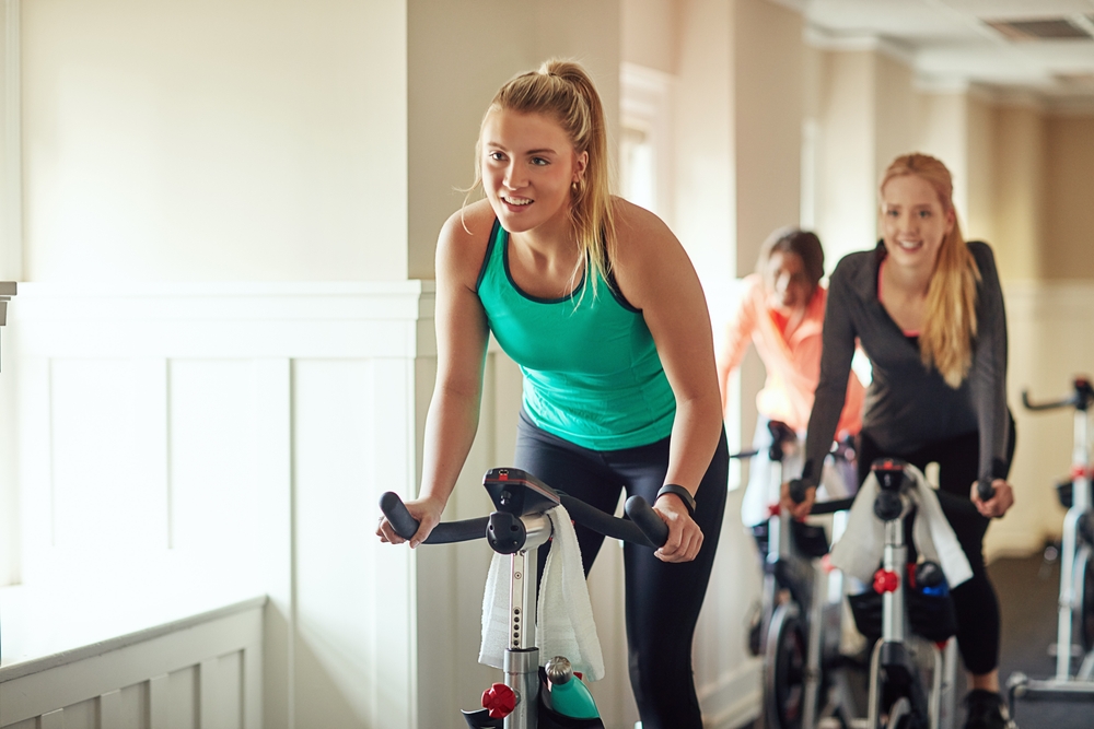 Woman,,Exercise,Bike,And,Gym,For,Performance,,Training,And,Cycling